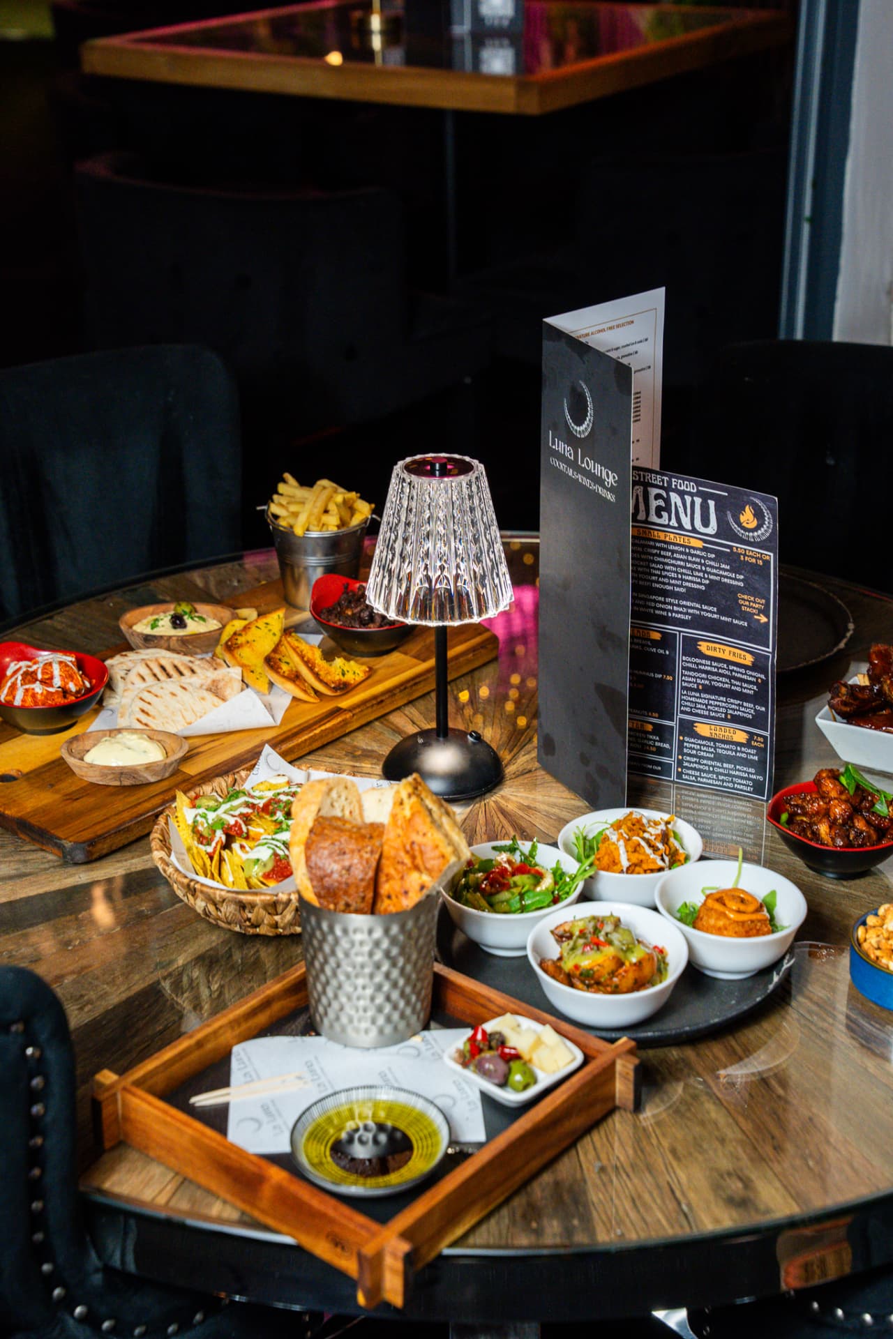 Tapas and street food spread at La Luna